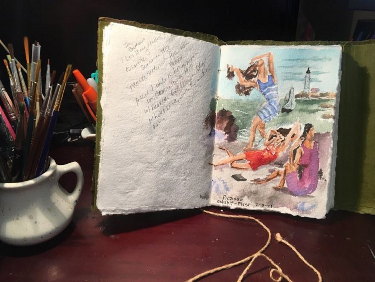 An open journal page with a hand-drawn portrait, used as a visual journaling example